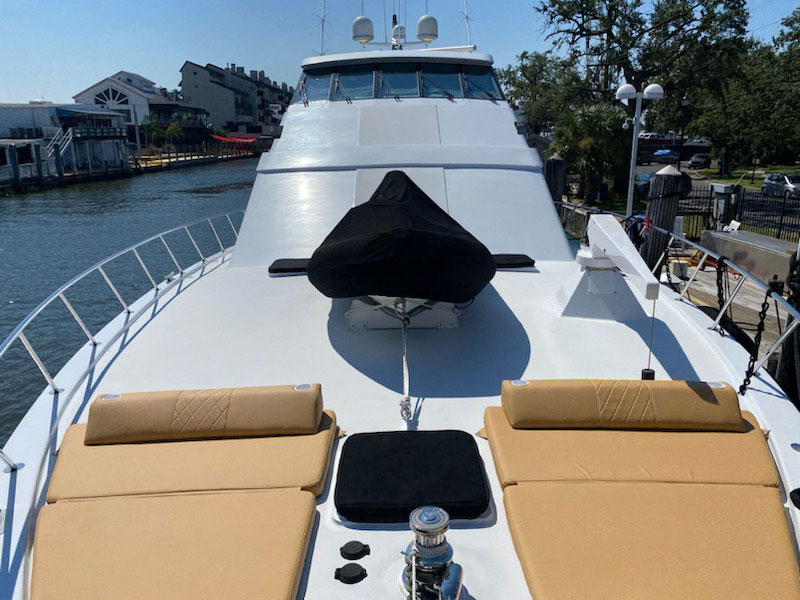 the-canvas-man-boat-exteriors_ Luxury yacht bow seating with covered helm area.