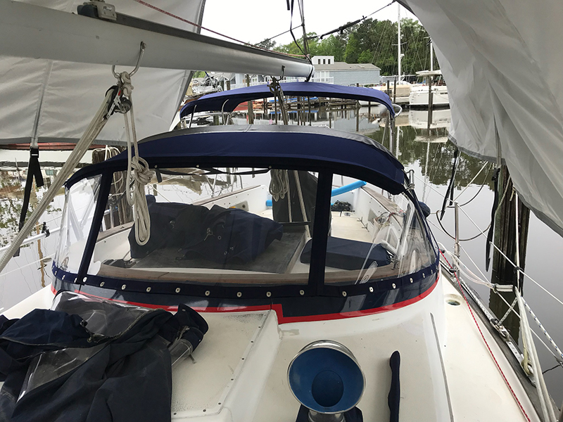 IMG_1604_800px Sailboat cockpit with blue canvas bimini top docked.
